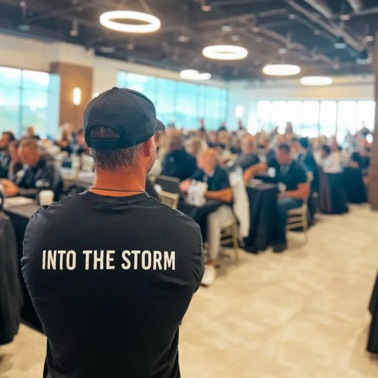 A speaker addresses Wealth Outside Wall Street community members in a workshop.